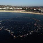 bondi paddle out surfers paddleboarders and swimmers pay tribute to victims of mass shooting 69448c3c249f2