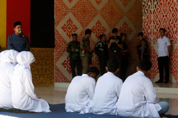 woman faints after being caned 140 times under indonesian provinces sharia law 697c97445138c