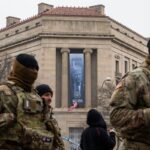 large trump banner hung at justice department headquarters 699793dc4643a